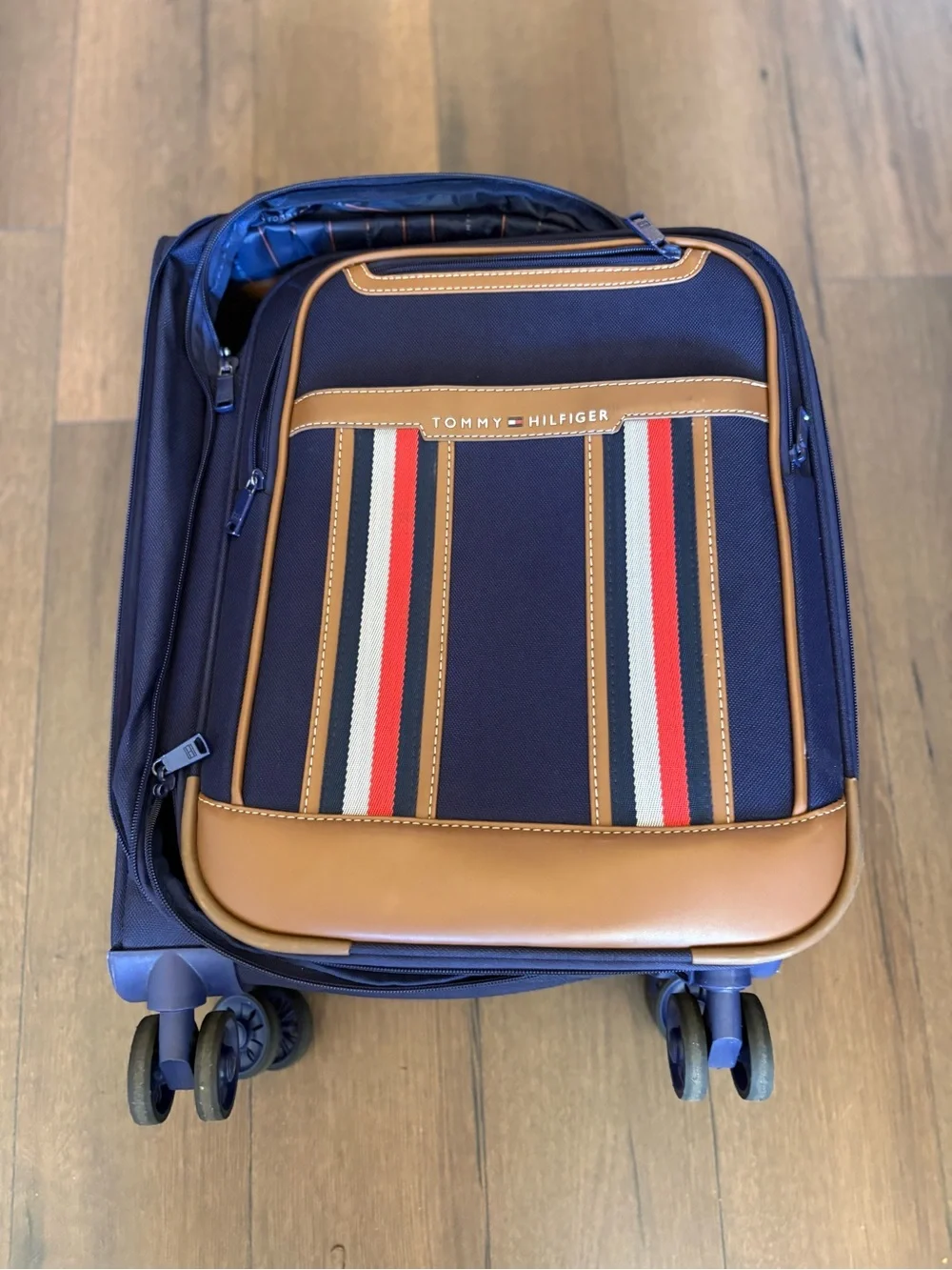 Tommy Hilfiger Navy Carry-On Suitcase with Brown Trim and Striped Pocket